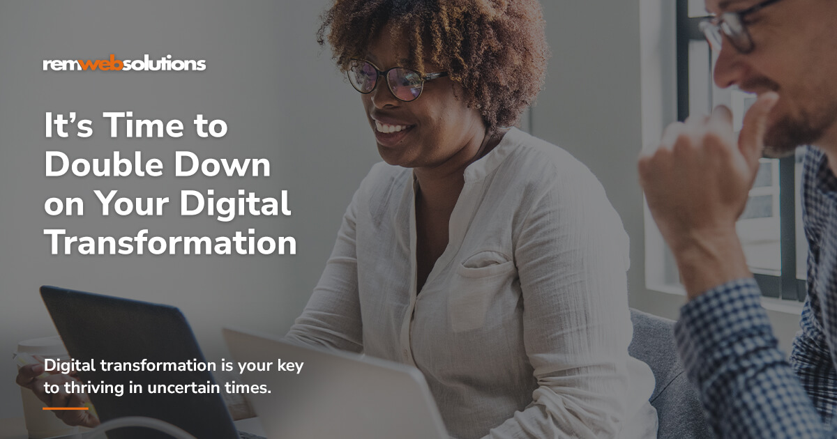 Two colleagues collaborating with text: 'It’s Time to Double Down on Your Digital Transformation.